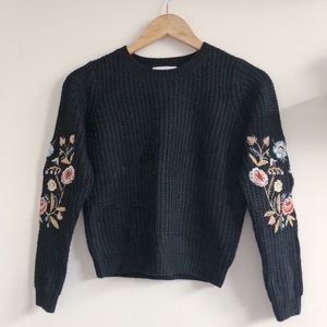 Nordstroms Black Sweater with Flower Design on Arm